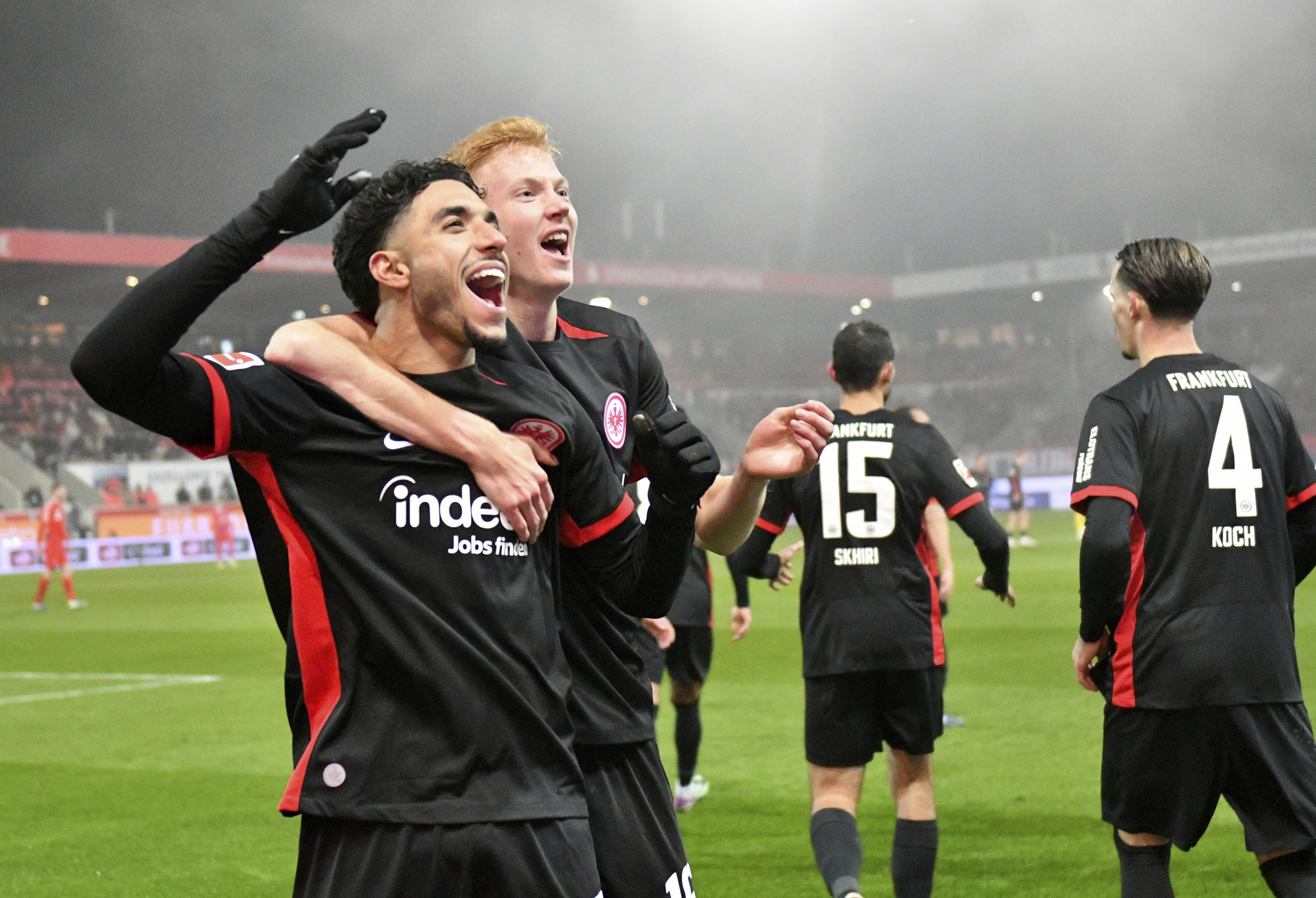 Hugo Larsson and Omar Marmoush celebrate Eintract Frankfurt's third goal against Heidenheim.